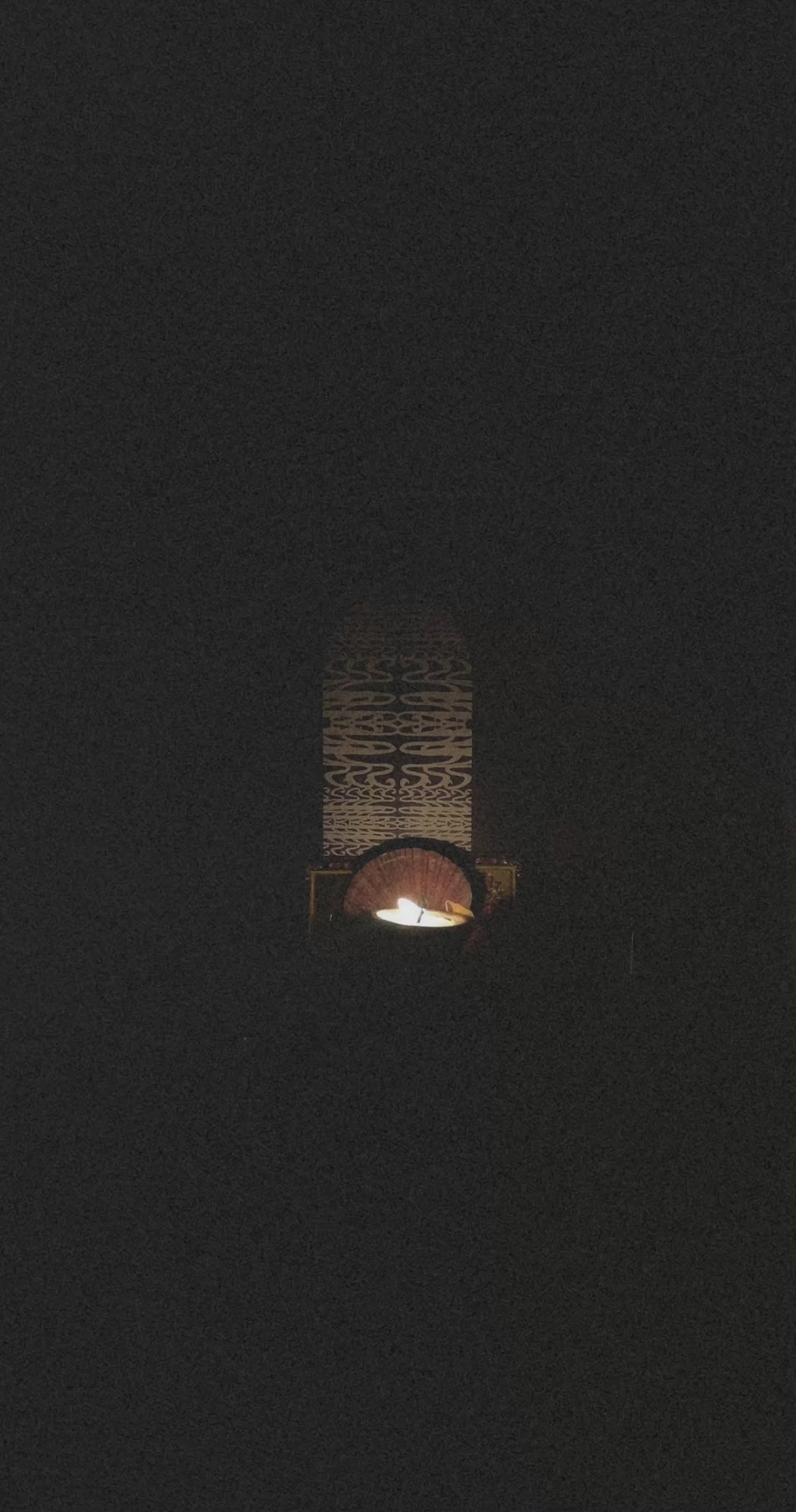 A candle shines on an altar print in a dark room, ritual art to be printed as wall art from The Ancient Now