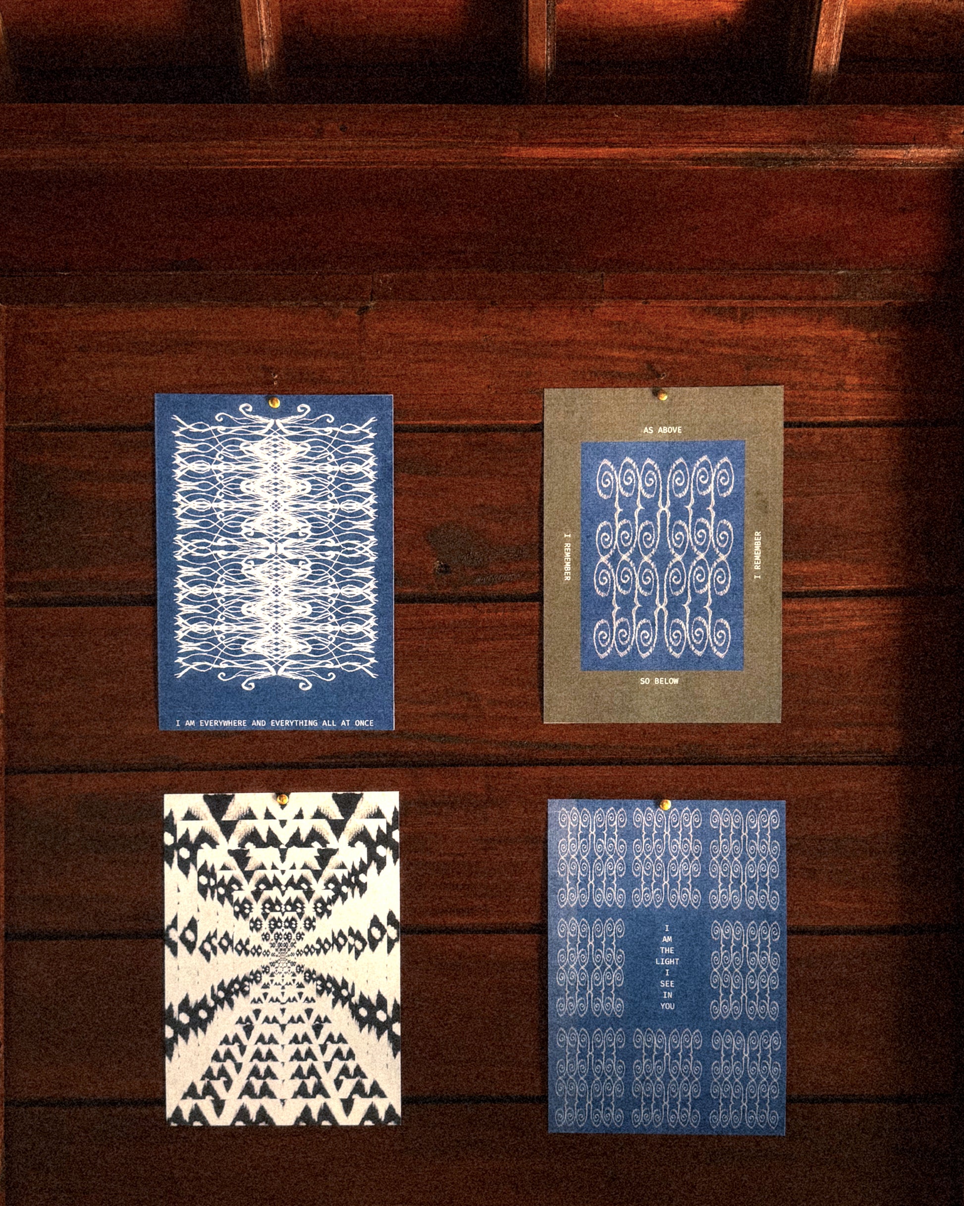 Four patterned cards on a wooden surface,  ritual art to be printed as wall art from The Ancient Now.